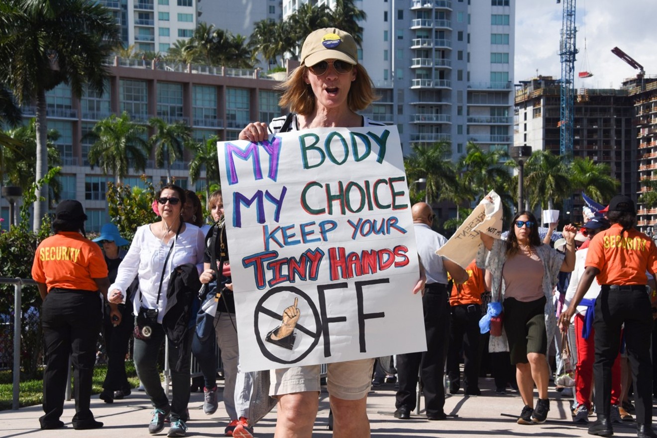 A protester holds a sign at the Miami Women's March in 2017.