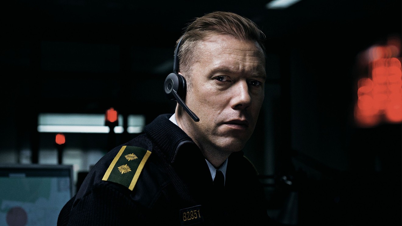 In Danish director Gustav Möller’s The Guilty, Jakob Cedergren plays Asger Holm, a police officer who has been temporarily demoted to working the phones, and is on the line with a woman who is being abducted by her ex-husband.