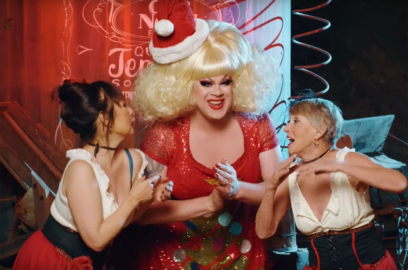 Longtime drag performer Nina West (center) will host this year's A Drag Queen Christmas.