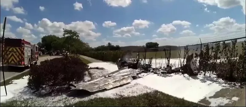 The plane plummeted to the ground and collided with Bishop's SUV within earshot of a runway, outside an airport fence on SW 72nd Avenue.