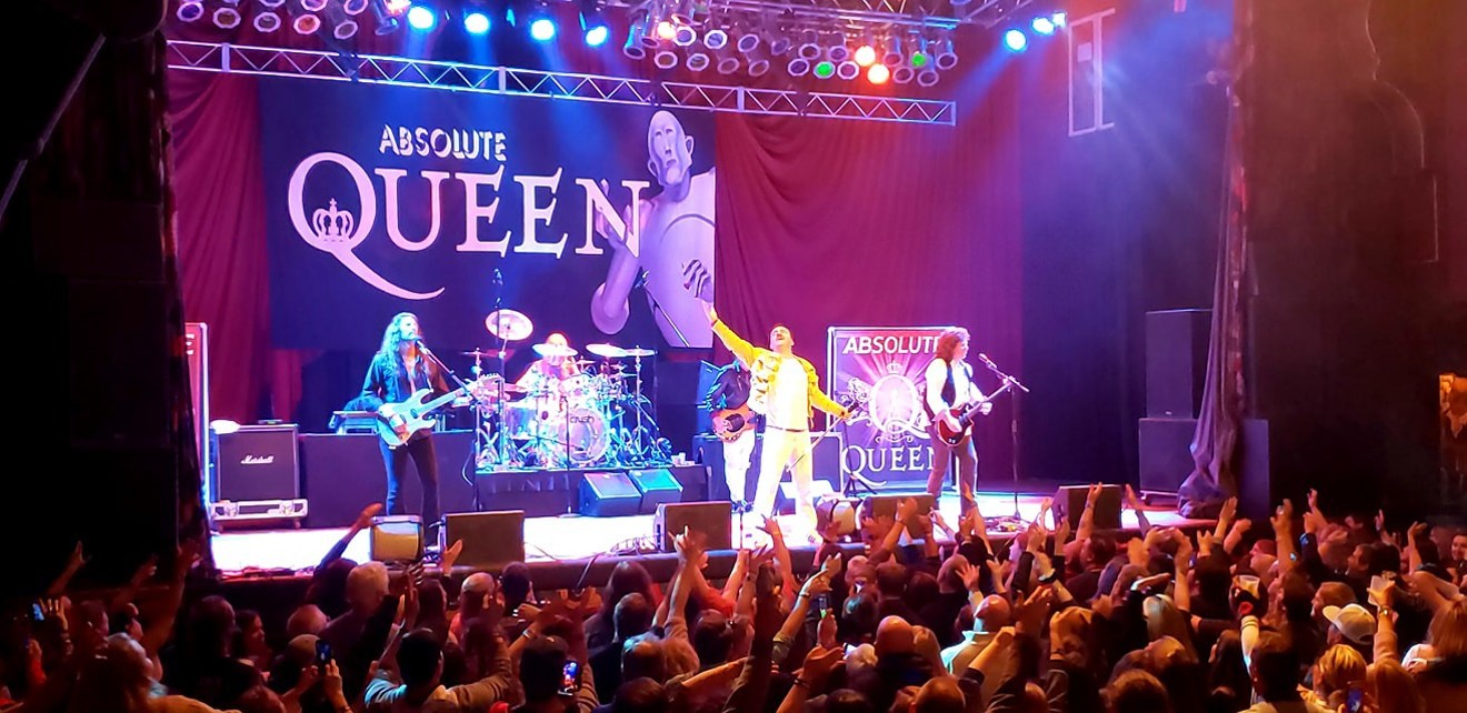 Martyn Jenkins, lead singer of Absolute Queen, performs with his band.