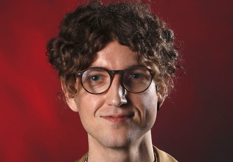 Image: A journalist's headshot.