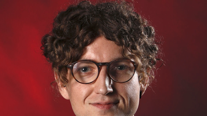 A journalist's headshot.