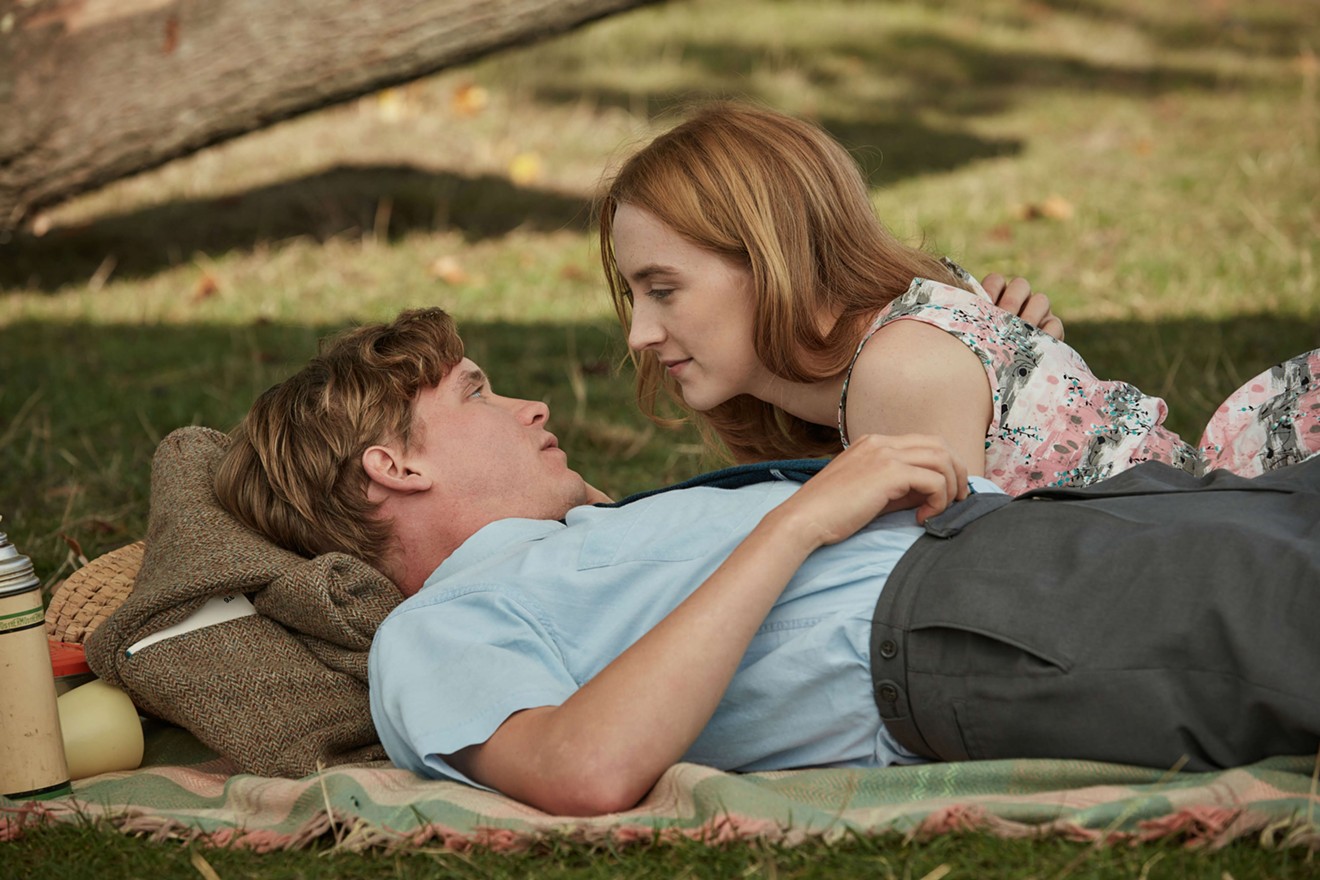 Billy Howle (left) and Saoirse Ronan play young newlyweds very much in love with but still painfully awkward around each other during their wan honeymoon in Dominic Cooke’s On Chesil Beach.