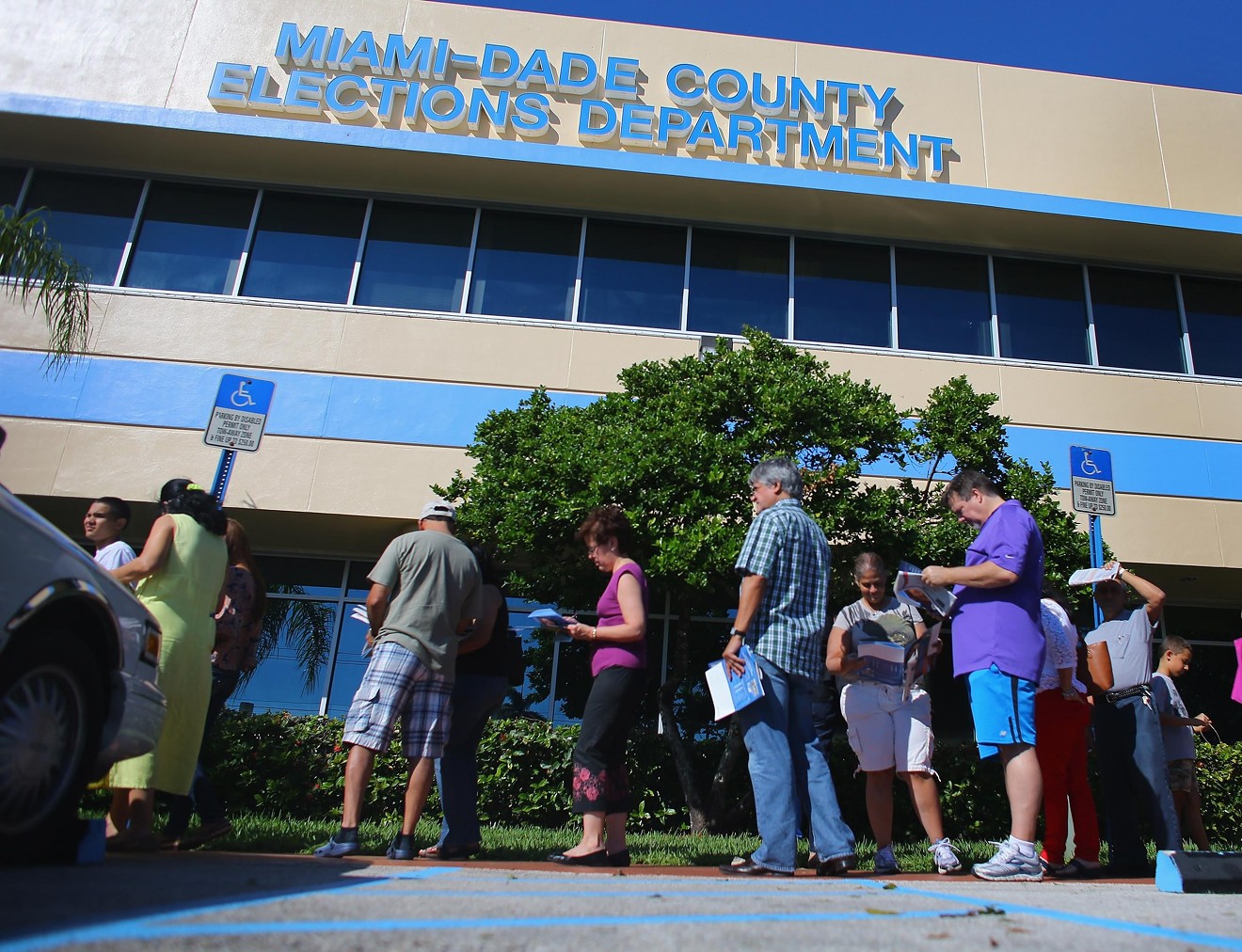 Voters gather outside the Miami-Dade County Elections Department.