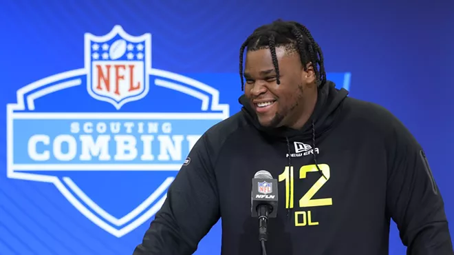 Kenneth Grant #DL12 of Michigan, dreadlocked and smiling, speaks to the media during the 2025 NFL Combine at the Indiana Convention Center on February 26, 2025