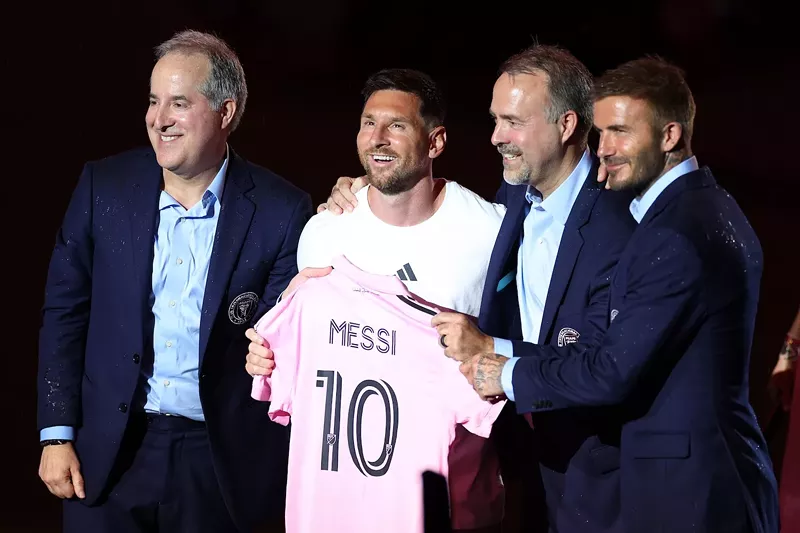 Image: From left: Jorge Mas, Lionel Messi, José Mas, and David Beckham introduce Lionel Messi at DRV PNK Stadium in Fort Lauderdale, Florida, on July 16, 2023