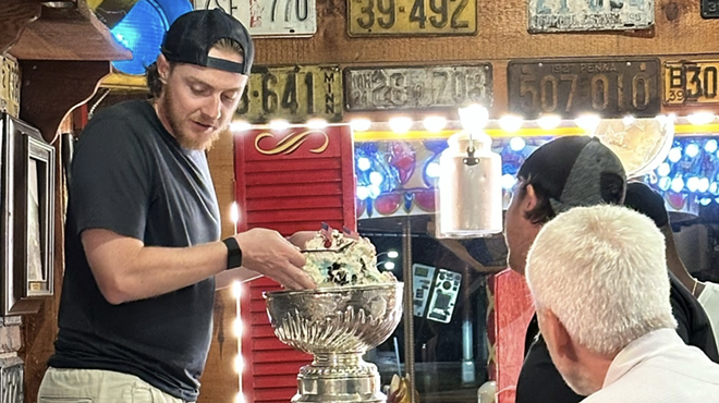 man holding trophy