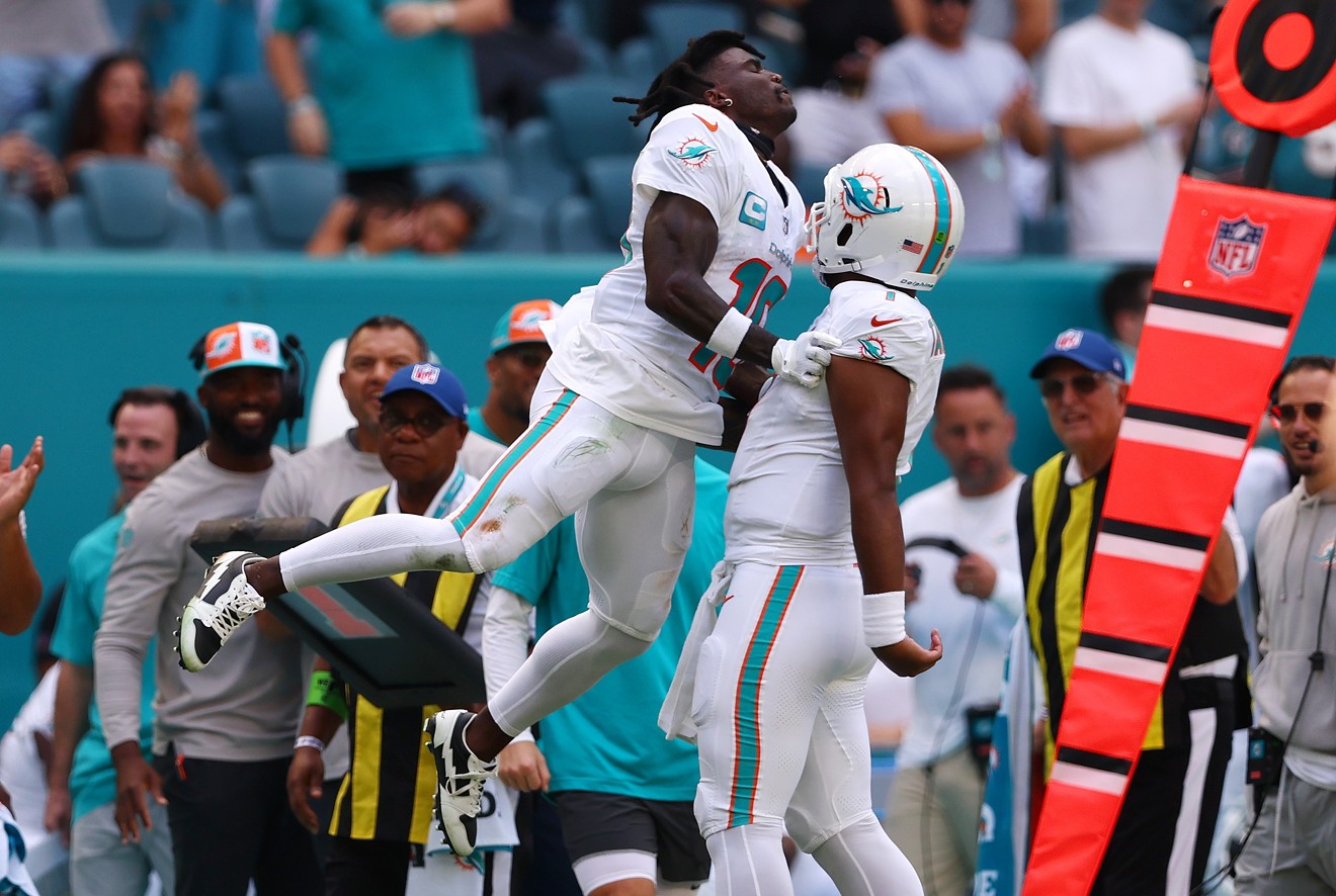Tyreek Hill celebrates a touchdown with Tua Tagovailoa during a game against the Carolina Panthers at Hard Rock Stadium on October 15, 2023.