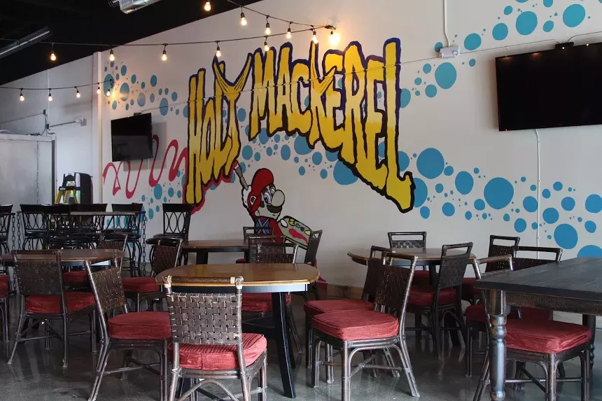 The tasting room includes a ten-seat bar and spacious seating area sporting custom murals. - PHOTO BY NICOLE DANNA