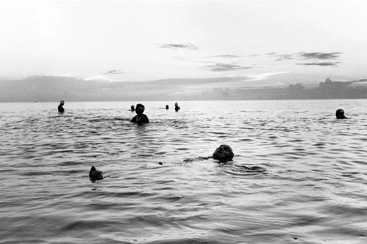 Gary Monroe, Sunrise Swimmers 10th Street (1980), gelatin silver print. - PHOTO COURTESY OF GARY MONROE