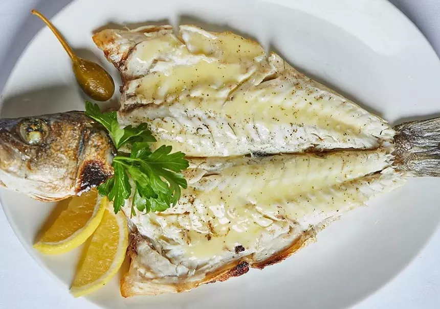 At Avra, fresh-caught fish is flown in daily from across the Mediterranean, then prepared simply over a charcoal fire. - PHOTO COURTESY OF THE AVRA GROUP