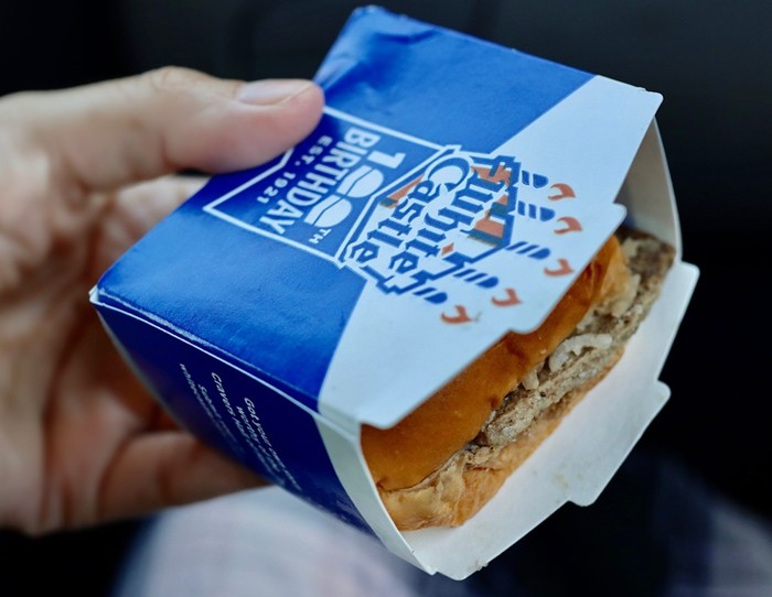 A single crate from the Crave Pallet holds 100 individually boxed White Castle sliders like this one. - PHOTO BY NICOLE DANNA