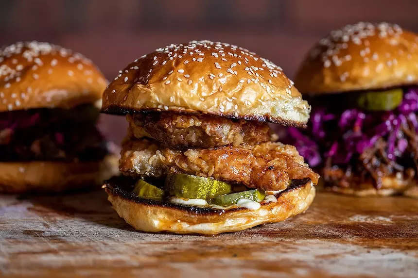 Izzy's Brooklyn Smokehouse sandwiches include a popular fried smoked chicken sandwich and a pulled beef topped with coleslaw, pickles, and the house barbecue sauce. - PHOTO COURTESY OF IZZY'S BROOKLYN SMOKEHOUSE
