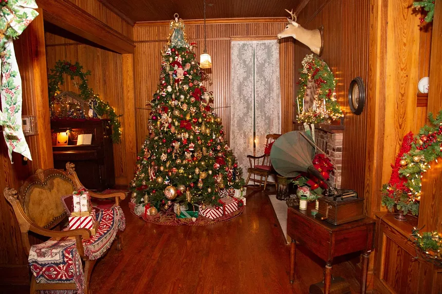 Victorian Christmas tour guides at Strahan House dress up in old fashioned attire for that old-timey feel. - PHOTO BY CLAY WIELAND PHOTOGRAPHY