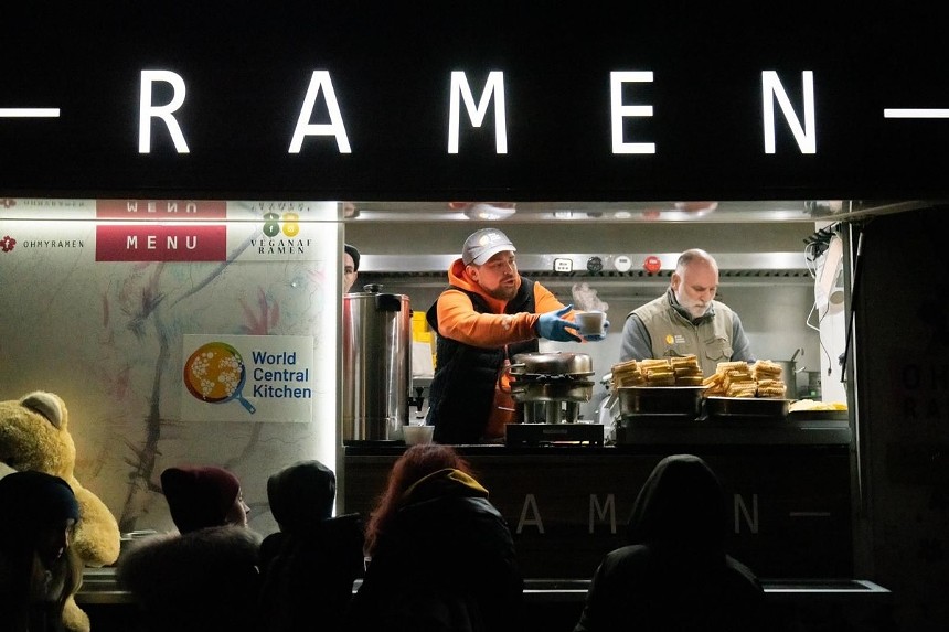 Chef José Andrés and WCK volunteers feeding people from a food truck in Poland. - PHOTO COURTESY OF WORLD CENTRAL KITCHEN