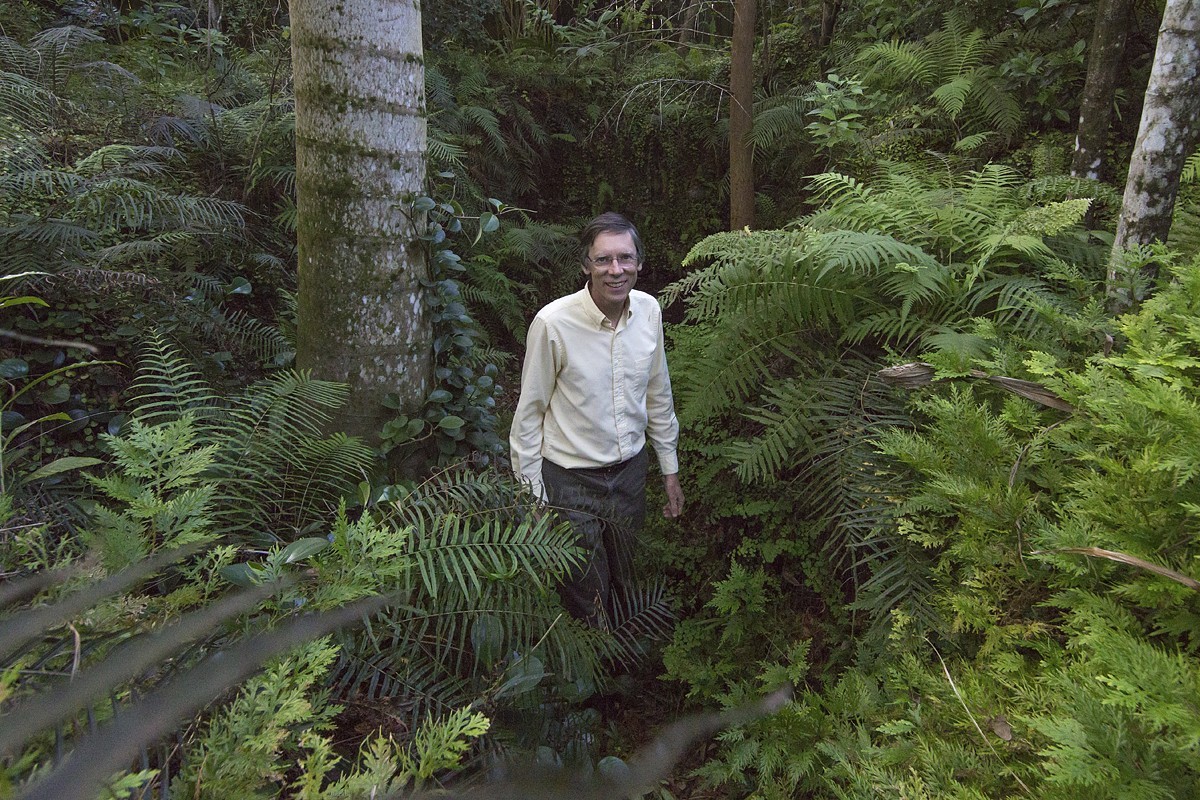 Phil Stoddard in his lush yard.